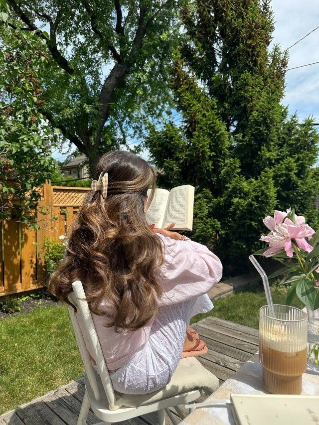 Cozy summer reading session in a Nordic garden.