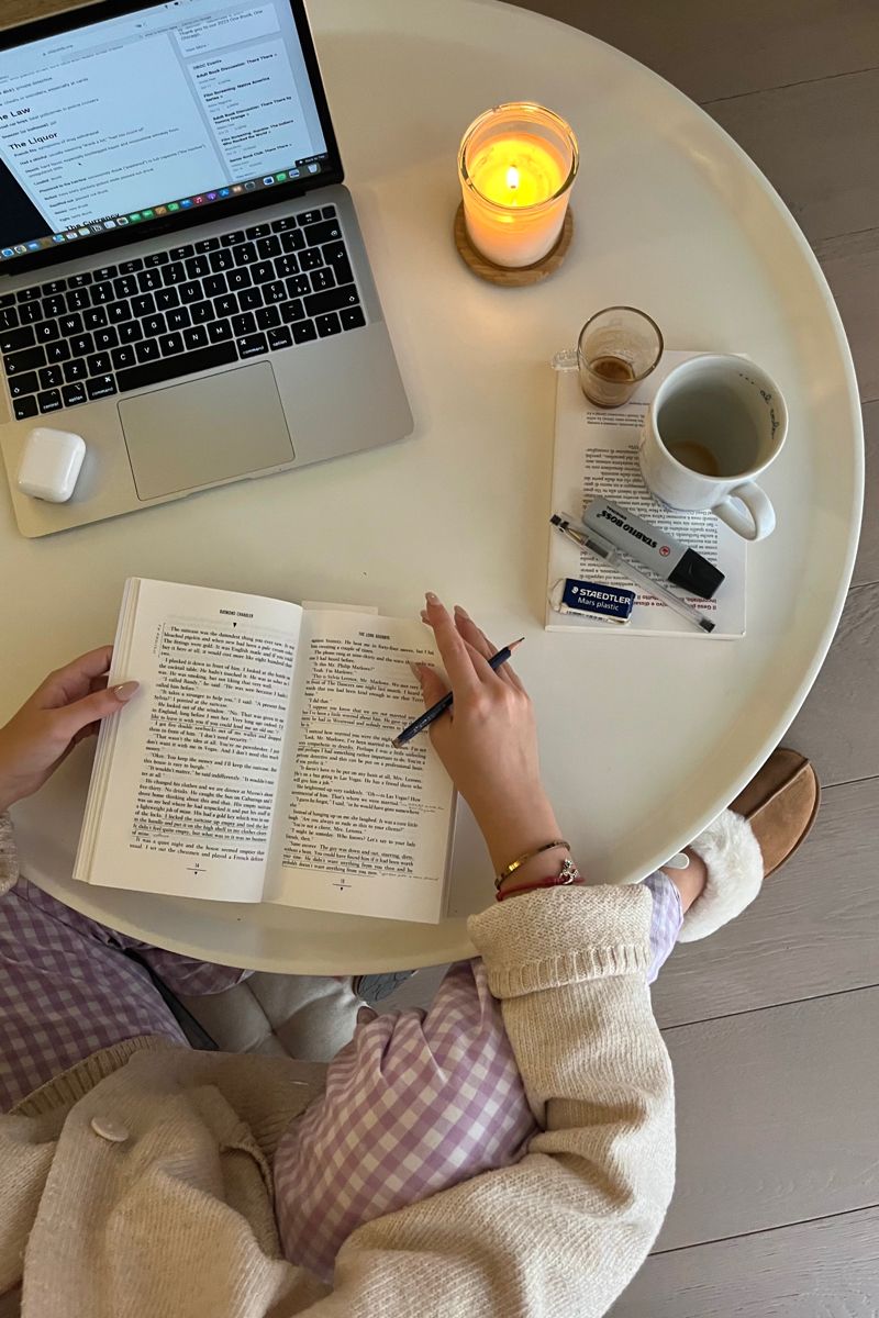 Cozy workspace setup with a physical notebook and warm lighting